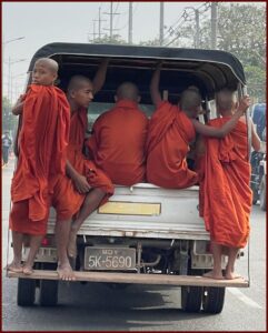 Busful of monks in Thailand_via The Big 65 and Karl Bruns-Kyler.