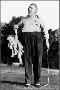 WC Fields holding a kid for The Big 65.