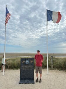 Haas standing near Utah Beach in Normandy.