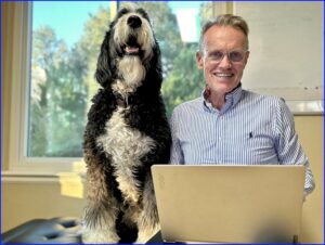 Karl and his faithful dog Plato preparing for Medicare's Annual Election Period.