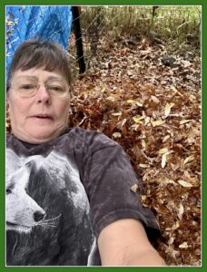 Gail playing in the leaves in Ohio.