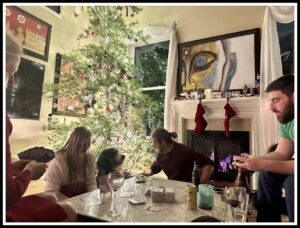 Karl and his family playing card games near the Christmas tree.