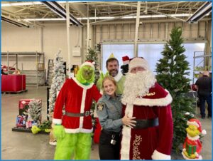Quantz volunteers with sheriffs department at Walmart toy drive.
