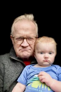 Rob and his grandson sit for a portrait.