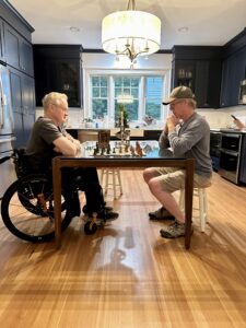 Rob and Hass playing chess in the kitchen in Virginia.