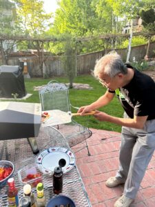 Patrick making his own pizza in Karl's backyard.