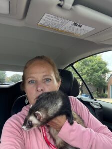 Quantz holding a ferret.