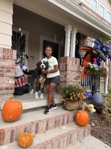 Miti on the front porch with Plato.