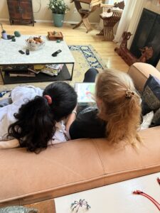 Quantz and Miti sitting on a sofa.