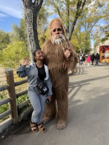 Miti looking up at Bigfoot.