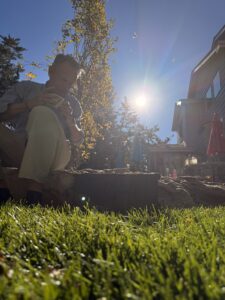 Karl sitting in his back yard.