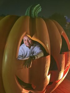 Miti looking through the eye of a Halloween Jack-O-Lantern.