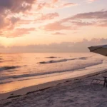 Two beach chairs at sunset, a guide to choosing the best Florida Medigap plans.