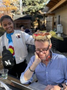 Miti putting a wreath on Karl's head.
