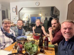 Karl and family at the Thanksgiving dinner table.