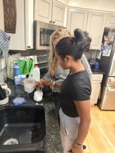 Mitia and Quantz working together in the kitchen.