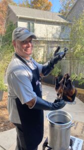 Sean holding a deep fry turkey.