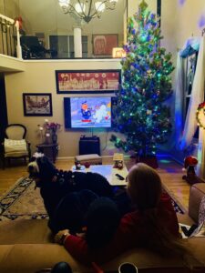 Quantz and Miti watching a Christmas show on television with Plato.