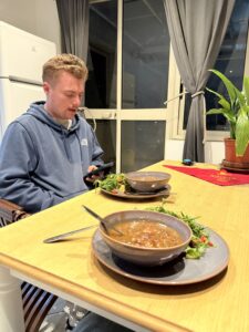 Nicholas looking at his phone.