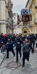 A group of people on the street celebrating.