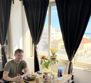 Nicholas sitting at a table.