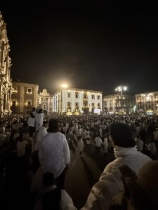 The Big 65 Medicare broker looking at a large group of people. 