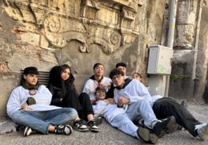 Young people on the sidewalk.