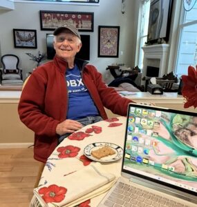 A gentleman sitting at a table.
