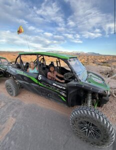 Miti and Quantz in a dune buggy in Utah.