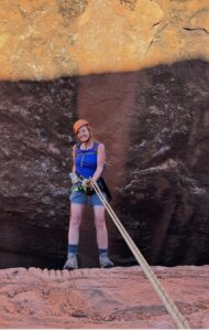 Quantz holding onto a rope.