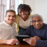 Elderly couple discussing care options with a nurse in an assisted living facility