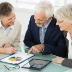 A senior couple comparing burial insurance quotes for final expenses.