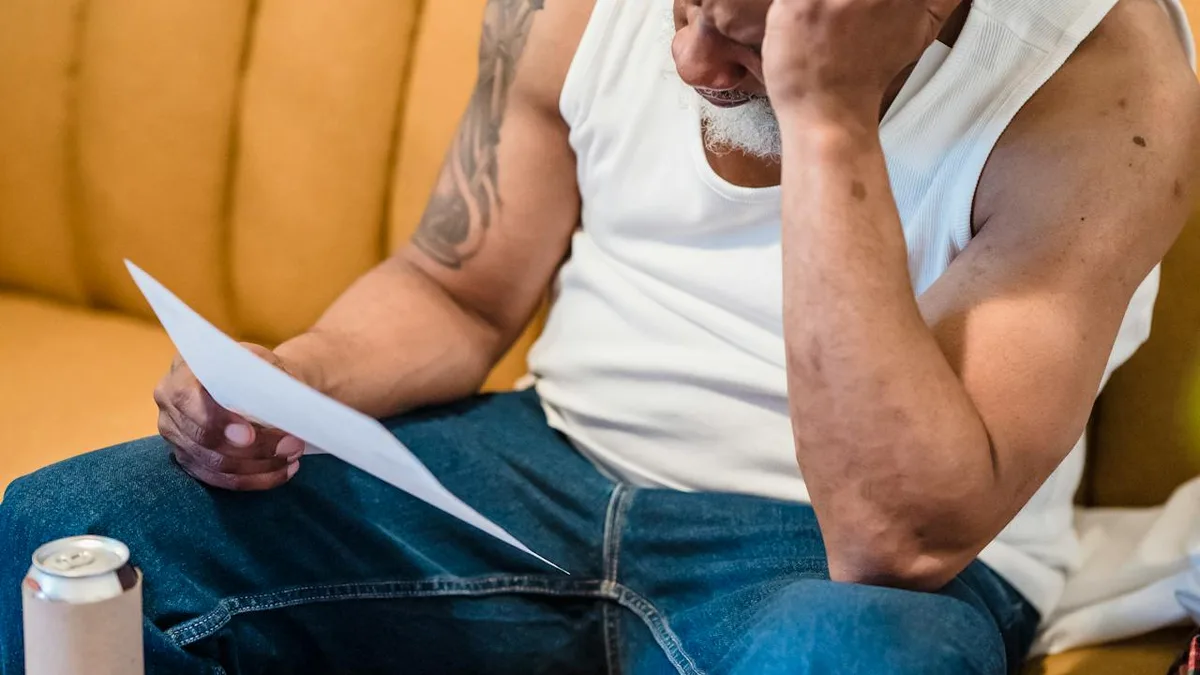 Senior man reviewing Medicare supplement insurance paperwork at home