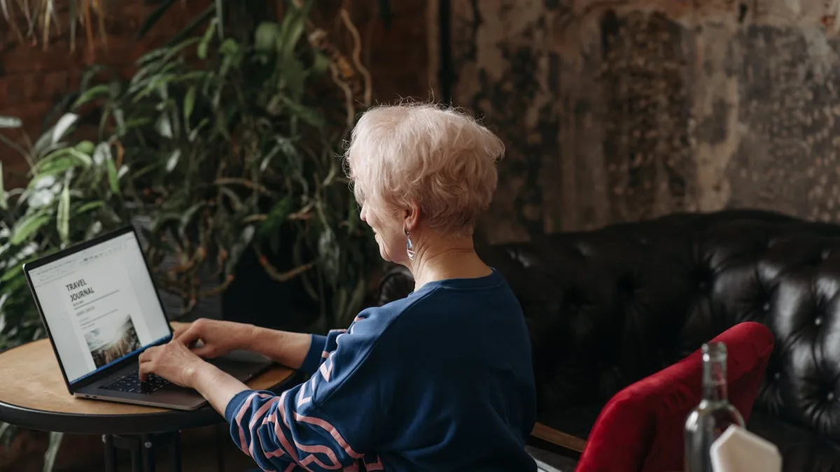 Senior woman researching Medicare enrollment options and retirement healthcare planning on laptop