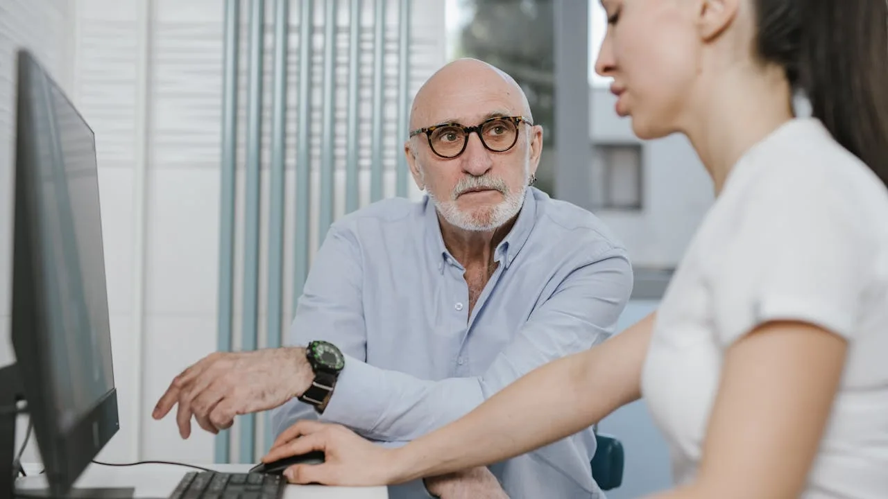 Senior patient discussing hearing aid options with a healthcare provider during a Medicare consultation