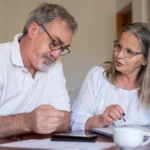 Medicare Part A vs Part B comparison guide showing seniors reviewing Medicare coverage options