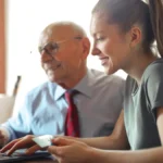 Senior man and adult daughter researching Medicare Supplement Plan F options on a laptop