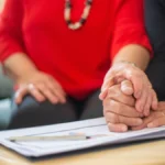 Senior couple consulting with a Medicare advisor about Medicare vs Medicaid differences