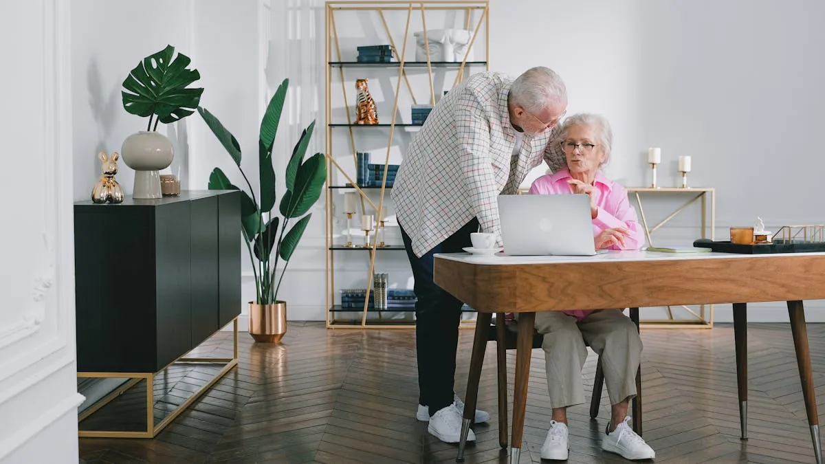 Senior couple reviewing Medicare enrollment paperwork at kitchen table