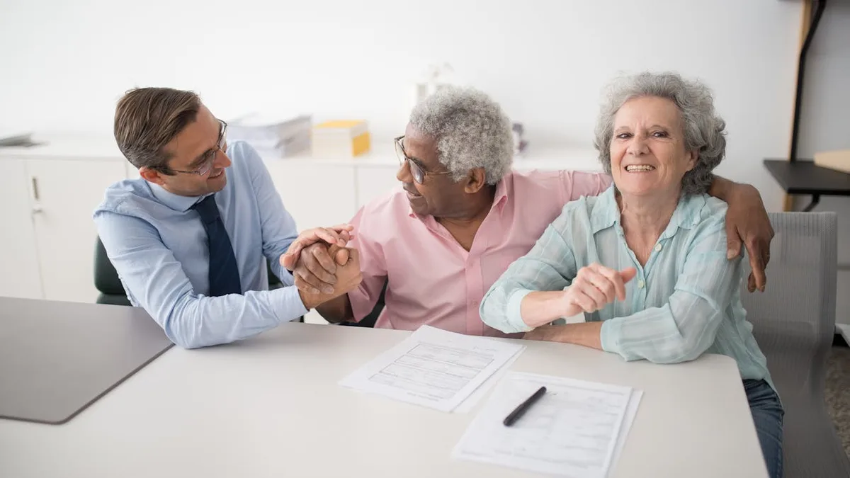 Senior couple meeting with a Medicare advisor to discuss Medicare Advantage plan options for 2026