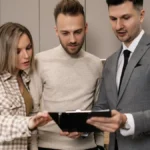 Senior couple reviewing Medicare plan options at kitchen table