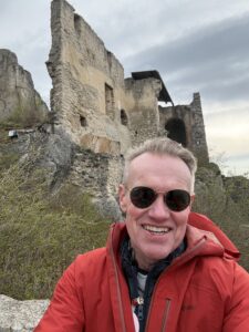 Karl standing in front of an old, historic building.