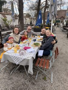 A group of people at a table having a meal together.