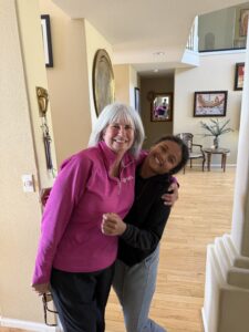 Elaine and Miti hugging each other.