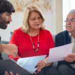 Senior couple consulting with a Medicare advisor about Arizona Medicaid income limits and Medicare enrollment options