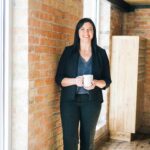 Veteran reviewing Medicare and VA benefits documents with military service records and healthcare options on desk