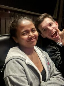 Miti and Santiago sitting together and looking at the camera.
