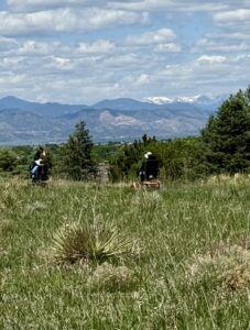 Two people on wheels in the mountains of Colorado.