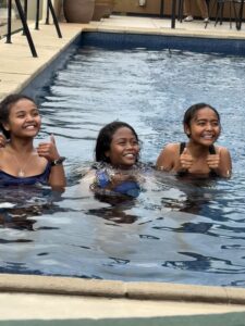 Mitia and her sisters in a pool.