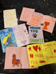 A stack of hand-written thank you notes from kids who have visited the zoo.